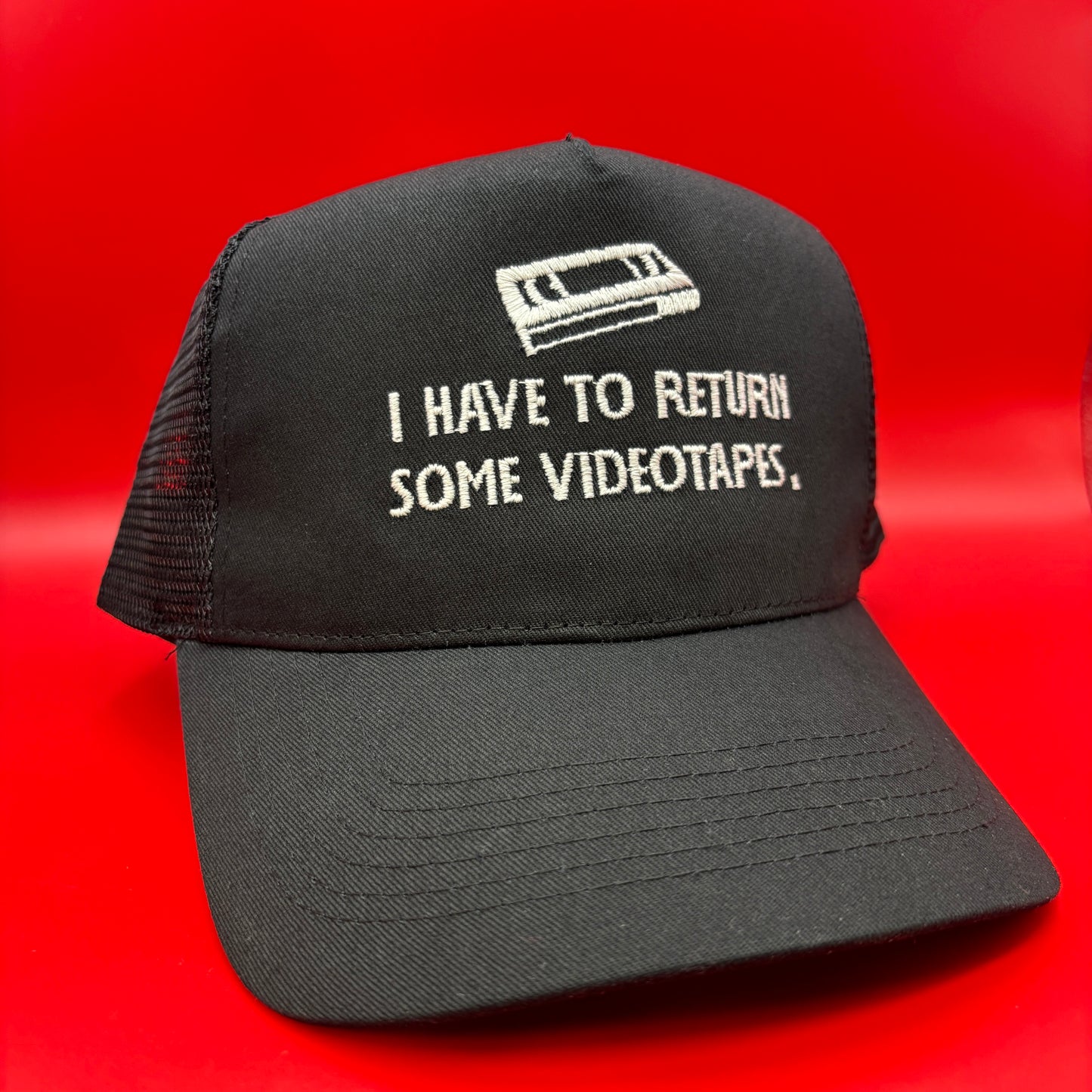 Return Videotapes Trucker Cap