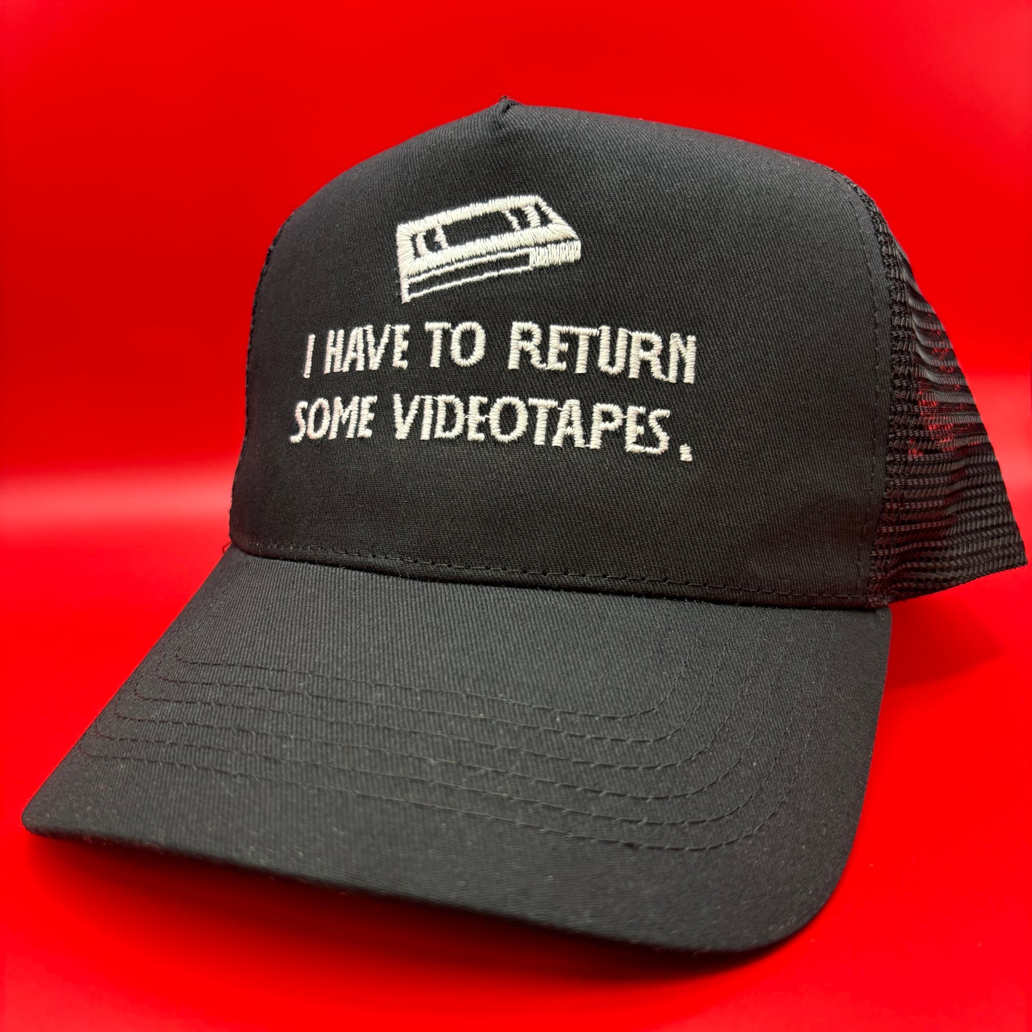 Return Videotapes Trucker Cap