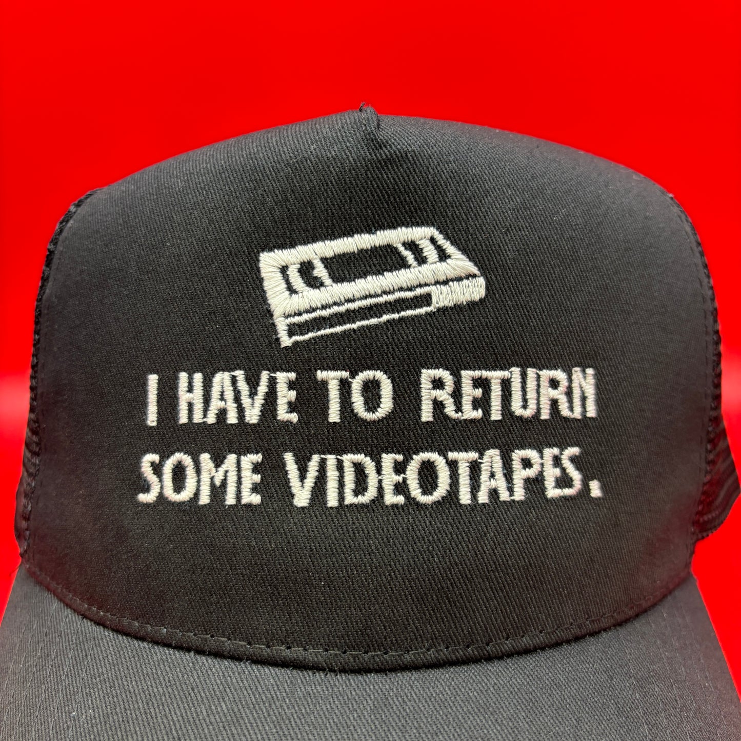 Return Videotapes Trucker Cap