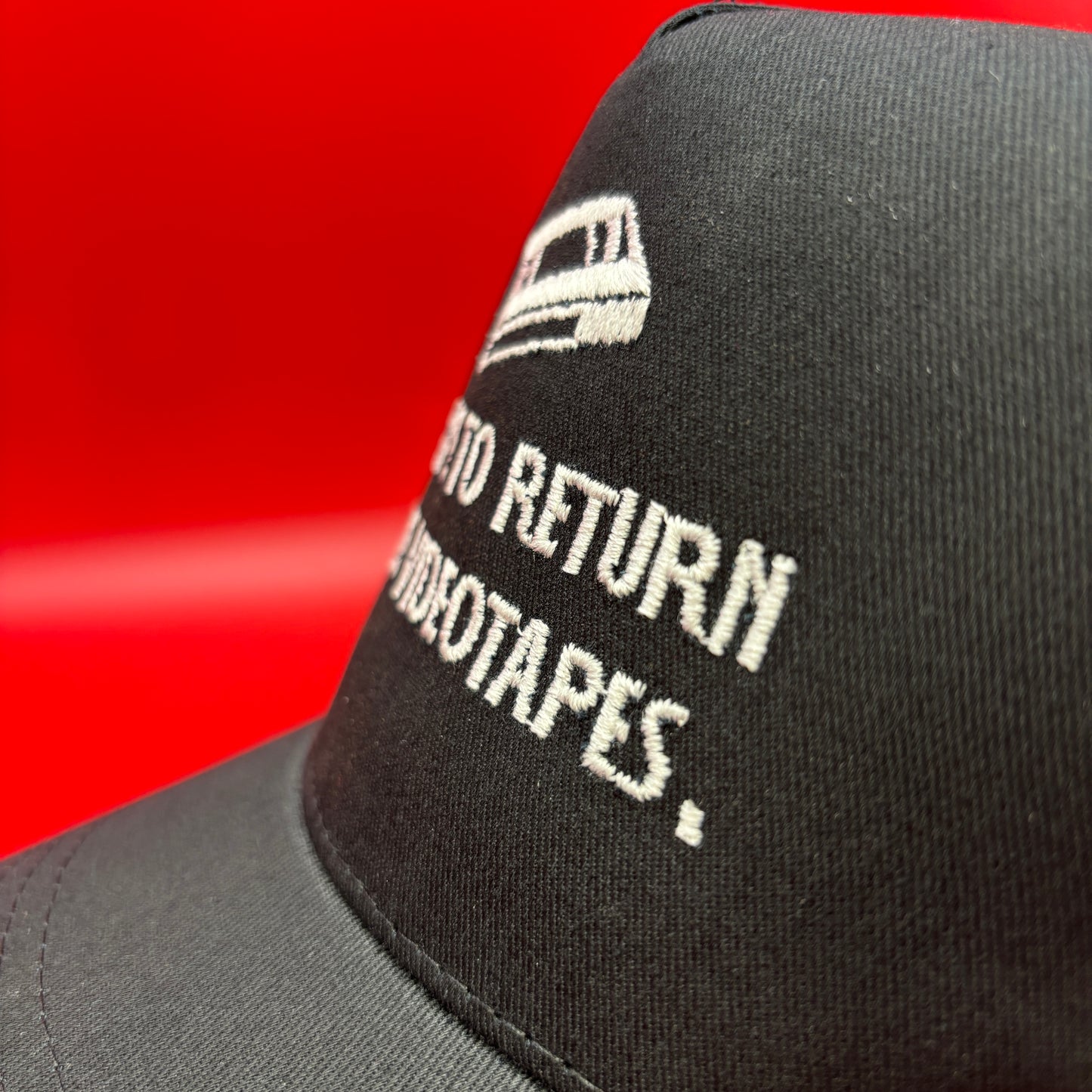 Return Videotapes Trucker Cap