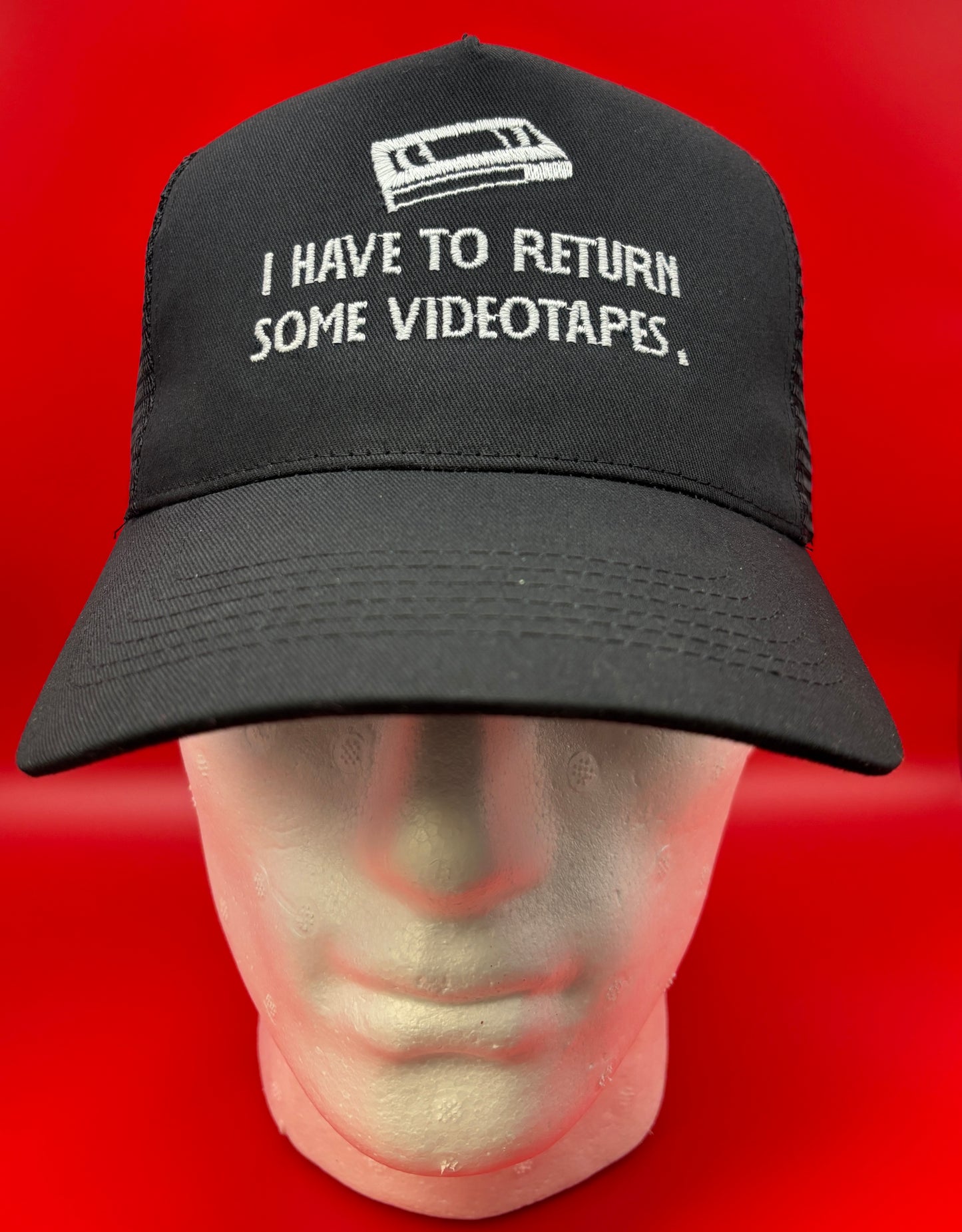 Return Videotapes Trucker Cap
